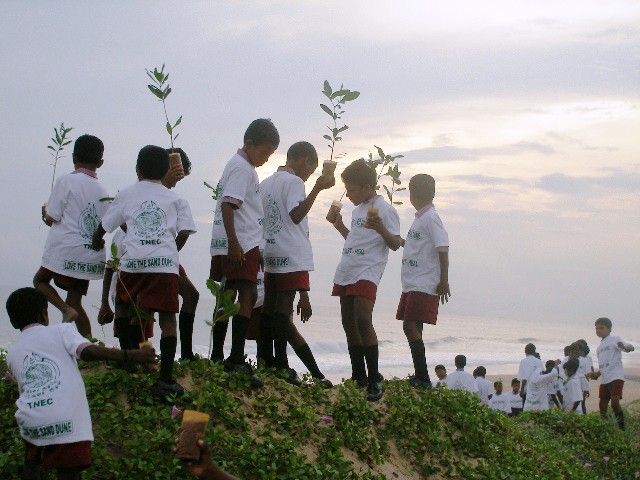 Women and children participating in coastal conservation awareness